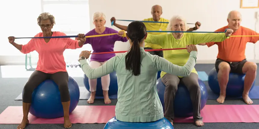 Group of people doing the mermaid pilates exercise